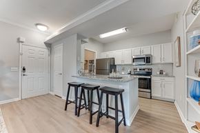 Lewisville apartment for rent - Modern kitchen with breakfast bar and stainless appliances at Limestone Ranch Apartments, Lewisville, TX 75067