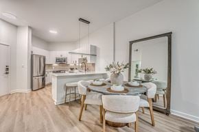 Dallas apartment for rent - Open concept kitchen and dining area with island seating at The Montrose Apartments, Dallas, 75204