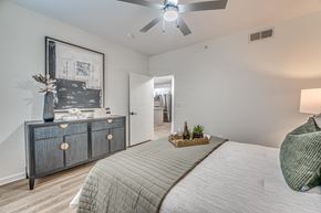 Dallas apartment for rent - Bedroom with ceiling fan and hardwood flooring at The Barton Apartments, Texas, 75206