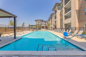 Resort style pool with tanning deck and sauna