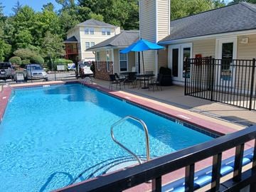 Hendersonville apartment for rent - A blue pool with a ladder in the middle of it.