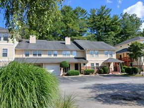 Hendersonville apartment for rent - A large building with a grey roof and a white garage door.