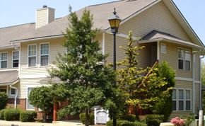 Hendersonville apartment for rent - A house with a tree in front of it.