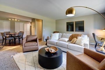 Naperville apartment for rent - A living room with a white couch and a coffee table.