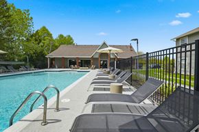 Lake Bluff apartment for rent - A pool with a black fence and a house in the background.