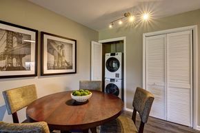 Naperville apartment for rent - a dining room with a table and chairs and a washing machine