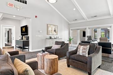 Naperville apartment for rent - A living room with brown chairs and a wooden coffee table.