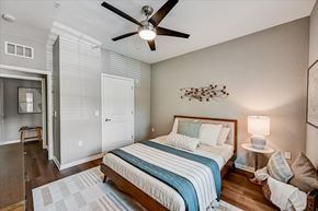 Bradenton apartment for rent - a bedroom with a bed and a ceiling fan