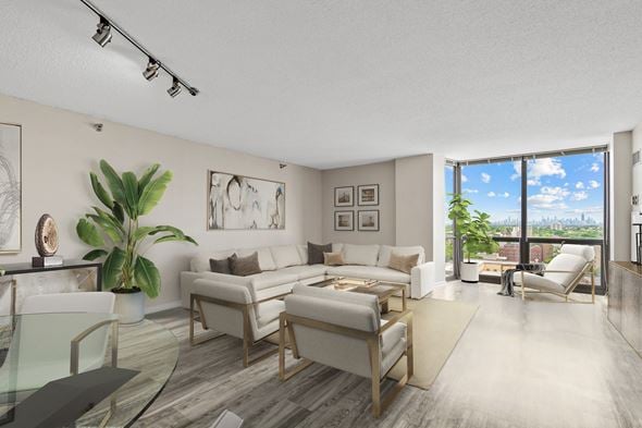 Oak Park apartment for rent - A modern living room with a glass table and a view of the city.