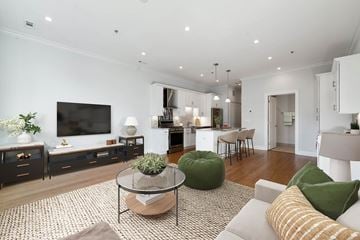 Chicago apartment for rent - A modern living room with a glass coffee table and a green bean bag chair.