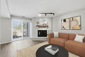Arlington Heights apartment for rent - A living room with a fireplace and sliding glass doors.