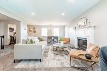 Gallatin apartment for rent - a living room with a white couch and a fireplace