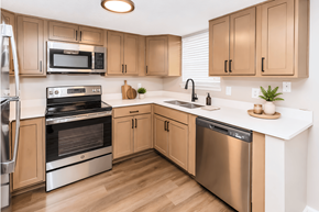 Gallatin apartment for rent - A kitchen with wooden cabinets and stainless steel appliances.