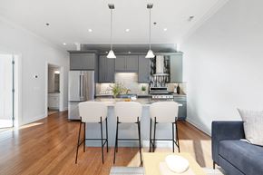 Chicago apartment for rent - A modern kitchen with a dining table set for two.