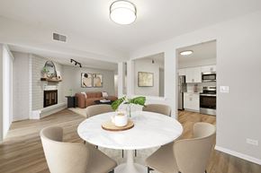 Arlington Heights apartment for rent - A modern dining room with a white table and chairs.