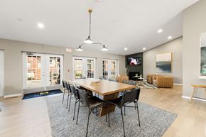 Lisle apartment for rent - A modern dining room with a wooden table and chairs.