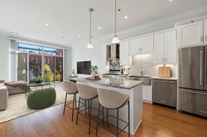 Chicago apartment for rent - A modern kitchen with a large island and stainless steel appliances.