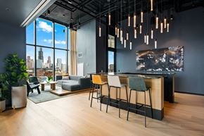 Chicago apartment for rent - A modern office space with a view of the city skyline.