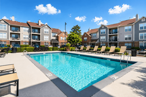 Lisle apartment for rent - A swimming pool in front of apartment buildings.