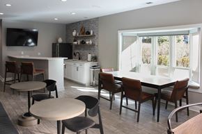 Naperville apartment for rent - A modern kitchen with a dining table and chairs.