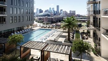 Pool area with four private cabanas with televisions