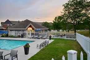 Woodbury apartment for rent - Valley Creek Apartments swimming pool surrounded by a sundeck and lawn