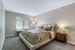 Buffalo Grove apartment for rent - a bedroom with a large bed and a window