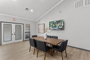 Southfield apartment for rent - A dining room with a wooden table and chairs.