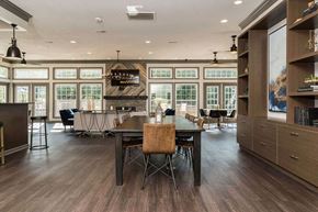 Dearborn apartment for rent - Fairlane Woods Apartments resident clubroom with ample seating and dining areas