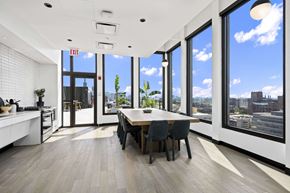 Chicago apartment for rent - large dining table by a coffee bar at Atrio Apartments in Chicago