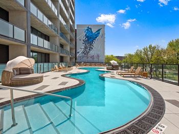 Oversized pool with sundeck and poolside cabanas