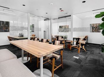 Co-working lounge with individual workstations and conference rooms