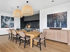 Chicago apartment for rent - A modern dining room with a wooden table and chairs.