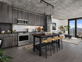 Chicago apartment for rent - A modern kitchen with a dining table and chairs.