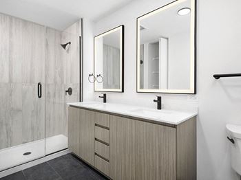 Glass walk-in showers with premium tile