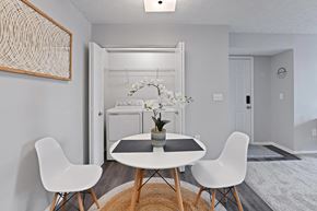 Columbus apartment for rent - a dining room with a table and chairs and a laundry room
