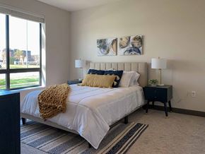 Lincoln townhouse for rent - a bedroom with a bed and a large window