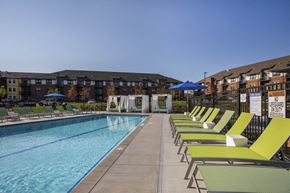 Woodbury apartment for rent - Outdoor swimming pool with cabanas and lounge chairs at Ascend at Woodbury MN 55129 new luxury apartments