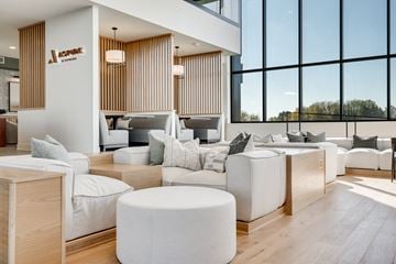 Woodbury townhouse for rent - a living room with white furniture and large windows