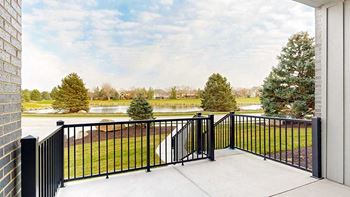 Two-bed meadow (#102) - walk-out patio pond view