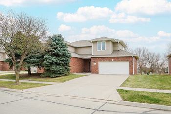 Ponderosa duplex front yard and garage