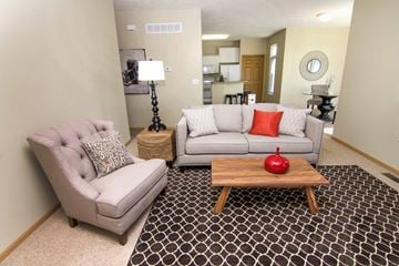 Lincoln triplex for rent - a living room with two couches and a coffee table