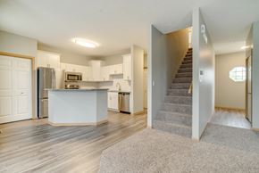 Lincoln triplex for rent - Living and dinning room area with view of kitchen and stairs to the second floor at Cascade Pines Duplex and Townhomes