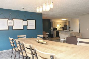 Omaha apartment for rent - a dining room and living room with a table and chairs