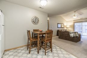 Lincoln apartment for rent - a dining room table and a living room with a couch