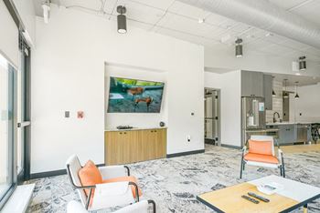 First floor entertainment suite with tv, high-speed internet, and areas to work from home