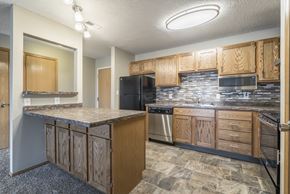 Lincoln apartment for rent - a renovated kitchen with tile backsplash and new appliances