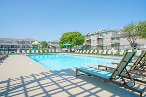 Lincoln apartment for rent - a rectangular pool with lounge chairs surrounding it