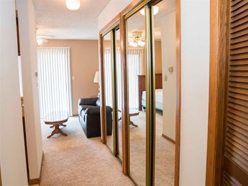 Lincoln apartment for rent - a living room with a couch and a mirrored closet