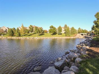 Exteriors-stone ridge estates garden with lake view